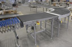 Assembly line with driven roller conveyor bend