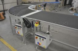 Assembly line with driven roller conveyor bend